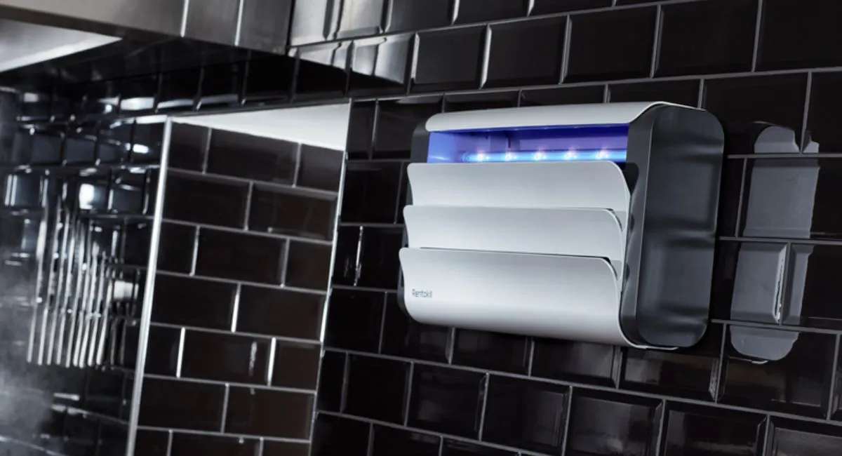 A Lumnia Standard LED light trap on a black tiled wall