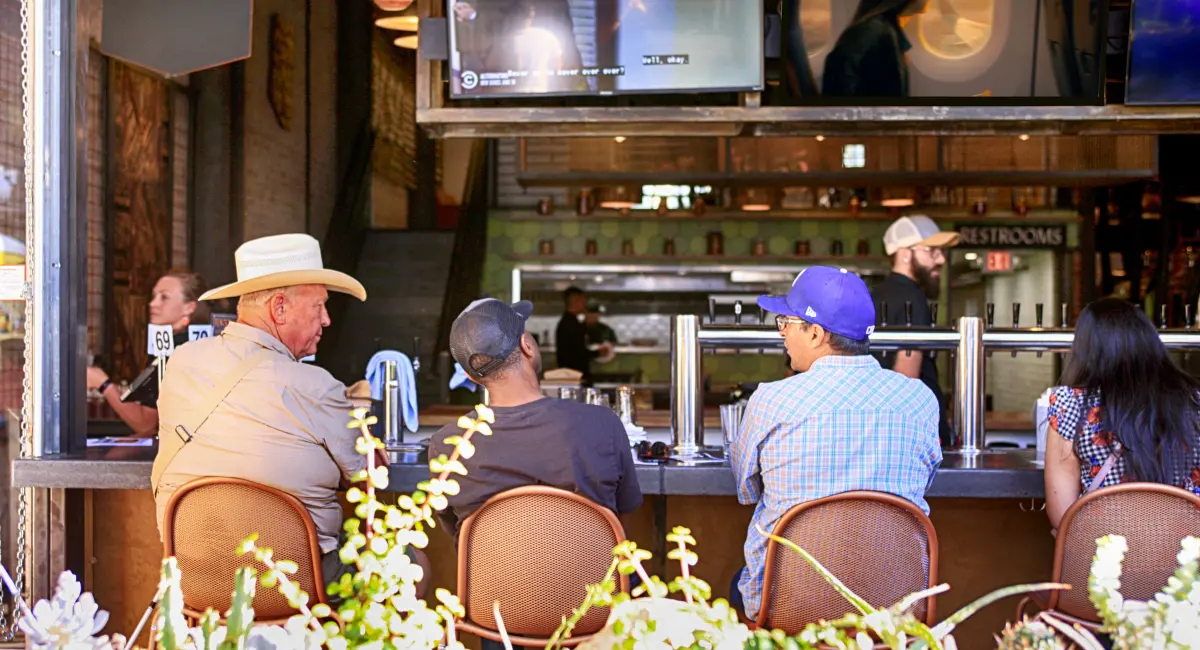 Customers sitting at a bar